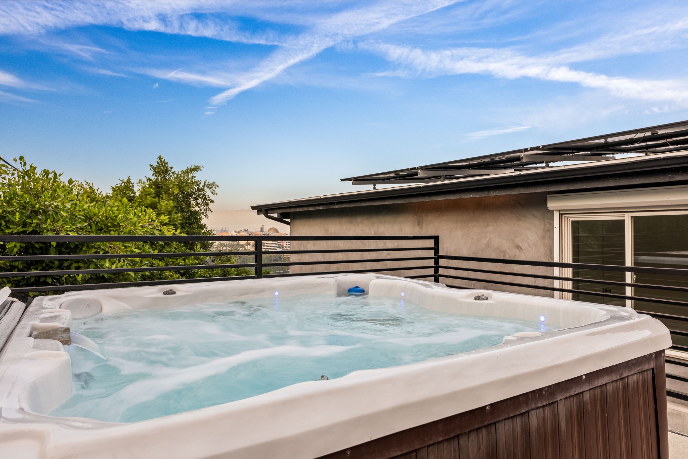 Private outdoor hot tub with hillside views